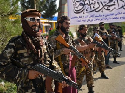 Taliban fighters stand guard near the venue of an open-air rally in a field on the outskirts of Kabul on October 3, 2021, as the Taliban supporters and senior figures held their first mass rally in a show of strength as they consolidate their rule of Afghanistan. (Hoshang Hashimi/AFP via …
