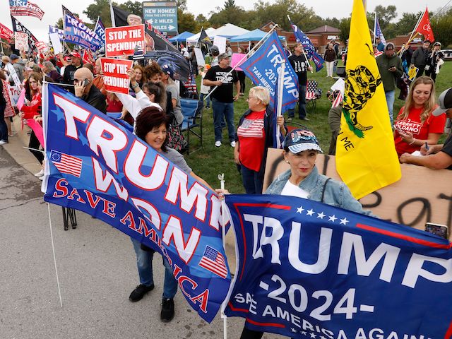Demonstrators protest the visit of US President Joe Biden to Howell, Michigan, on October 5, 2021. - Biden visits Howell to speak about his infrastructure bill and Build Back Better agenda. (Jeff Kowalsky/AFP via Getty Images)