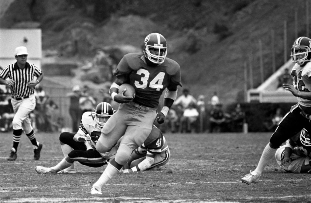 Georgia freshman running back Herschel Walker (34) heads up the field for some of his record-breaking 283 rushing yards in their 41-0 victory over Vanderbilt before 59,300 fans at Sanford Stadium in Athens, Ga., Oct. 18, 1980.