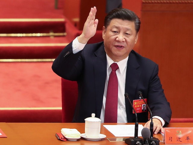 Chinese President Xi Jinping vote at the closing of the 19th Communist Party Congress at t