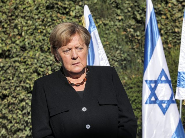 German Chancellor Angela Merkel pauses during a reception outside the Yad Vashem Holocaust Museum in Jerusalem on October 10, 2021. (Photo by Gil COHEN-MAGEN / AFP) (Photo by GIL COHEN-MAGEN/AFP via Getty Images)