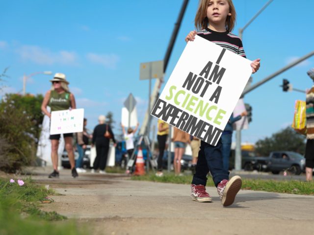 SAN DIEGO, CA - SEPTEMBER 28: Anti-vaccine protesters stage a protest outside of the San D