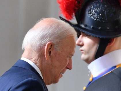 US President Joe Biden walks past a Swiss Guard as he arrives at San Damaso courtyard in The Vatican on October 29, 2021 for a private audience with the Pope, ahead of an upcoming G20 summit of world leaders to discuss climate change, covid-19 and the post-pandemic global recovery. (Photo …