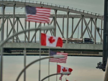 A truck crosses the Bluewater Bridge border crossing between Sarnia, Ontario and Port Huron, Michigan on March 16, 2020. - The Canadian government decided March 16, 2020 to close its borders to most foreign nationals with the exception of Americans. (Photo by Geoff Robins / AFP) (Photo by GEOFF ROBINS/AFP …
