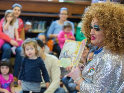 FILE - In this May 13, 2017, file photo, Lil Miss Hot Mess reads to children during the Feminist Press' presentation of Drag Queen Story Hour at the Park Slope Branch of the Brooklyn Public Library, in New York. The Drag Queen Story Hour is coming to northern Nevada. Two …