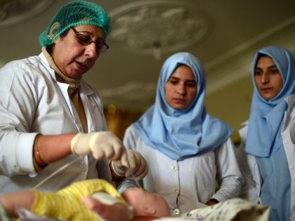 TO GO WITH Afghanistan-unrest-aid,FEATURE by Guillaume LAVALLÉE An Afghan midwife trainer