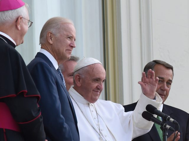 Sept 24, 2015; Washington, DC, USA; Pope Francis waves to the crowd from a balcony of the US Capital Building after addressing a joint session of Congress. With Pope Francis are, among others, Vice President Joe Biden, Speaker of the house John Boehner, and Congresswoman Nancy Pelosi. Mandatory Credit: Michael …