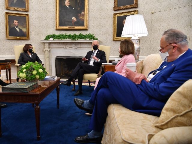 US President Joe Biden (3rd R) and US Vice President Kamala Harris (L) meet with members of Congressional Leadership, including Senate Majority Leader Chuck Schumer (R) and Speaker of the House Nancy Pelosi, to discuss policy areas of mutual agreement, in the Oval Office of the White House in Washington, …