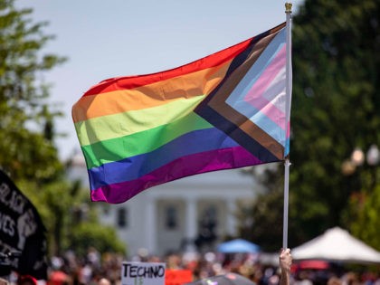 WASHINGTON, DC - JUNE 13: Members and allies of the LGBTQ community reach Black Lives Matter Plaza across the street from the White House as part of the Pride and Black Lives Matter movements on June 13, 2020 in Washington, DC. The larger official Pride events have been canceled due …