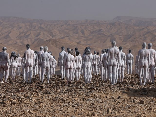 TOPSHOT - Participants pose nude for American art photographer Spencer Tunick, working on