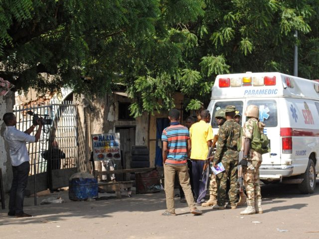 Emergency services and soldiers gather at the scene of a suicide bomb attack on a market in Maiduguri, after two girls approximately seven or eight years old blew themselves, killing themselves and wounding at least 17 others. The attack was not immediately claimed by the Boko Haram jihadist insurgency but …