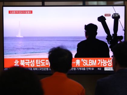 SEOUL, SOUTH KOREA - OCTOBER 02: People watch a TV showing a file image of a North Korean missile launch at the Seoul Railway Station on October 02, 2019 in Seoul, South Korea. North Korea fired what was believed to be a submarine-launched ballistic missile (SLBM) from waters off its …