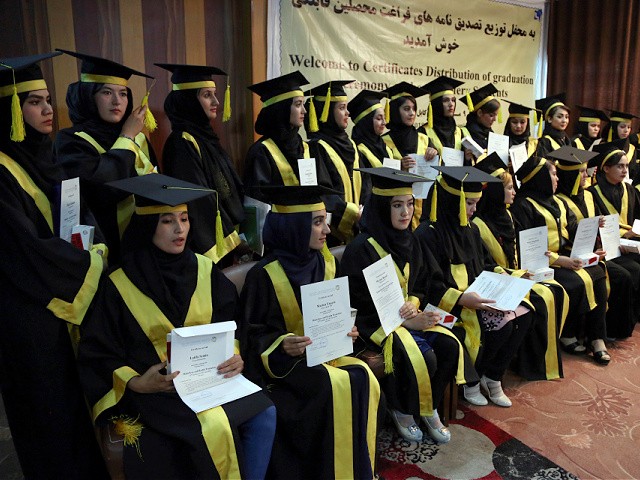 Afghan midwives attend a graduation ceremony after receiving 8 months of training by Tolo Service and Culture Organization, in a program financed by the Estonian Ministry of Foreign Affairs, in Kabul, Afghanistan, Monday, Oct. 1, 2018. (AP Photo/Rahmat Gul)