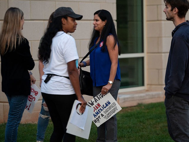 Protesters and activists stand outside a Loudoun County Public Schools (LCPS) board meetin