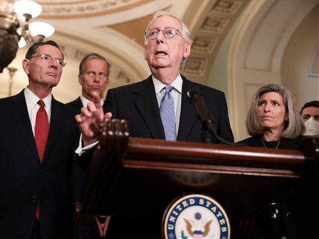 WASHINGTON, DC - OCTOBER 05: Senate Minority Leader Mitch McConnell (R-KY) addresses reporters following a weekly Republican policy luncheon as (L-R) Sen. Rick Scott (R-FL), Sen. John Barrasso (R-WY), Sen. John Thune (R-SD), and Sen. Joni Ernst (R-IA) look on in the U.S. Capitol on October 05, 2021 in Washington, …