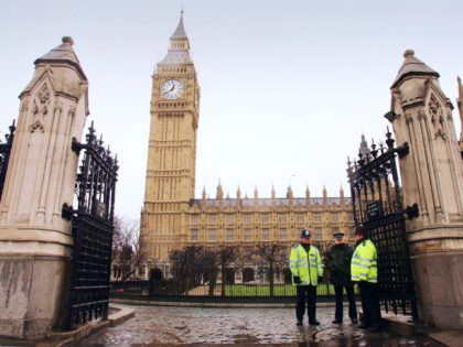 LONDON - FEBRUARY 24: Police officers stand guard outside of Britain's Houses of Parliament on February 24, 2005 in London, England. The Prevention of Terrorism Bill will be further scrutinized by the Commons on Monday before passing to the Lords. Prime Minister Tony Blair has defended his controversial anti-terror proposals …