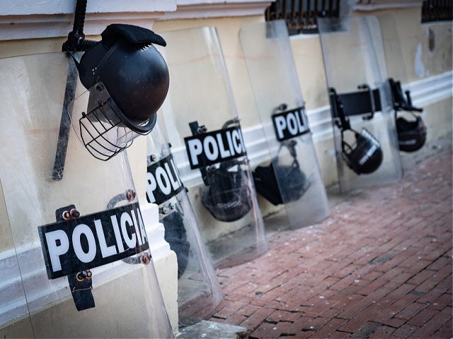 Police equipment such as shield and helmet on the street - stock photo