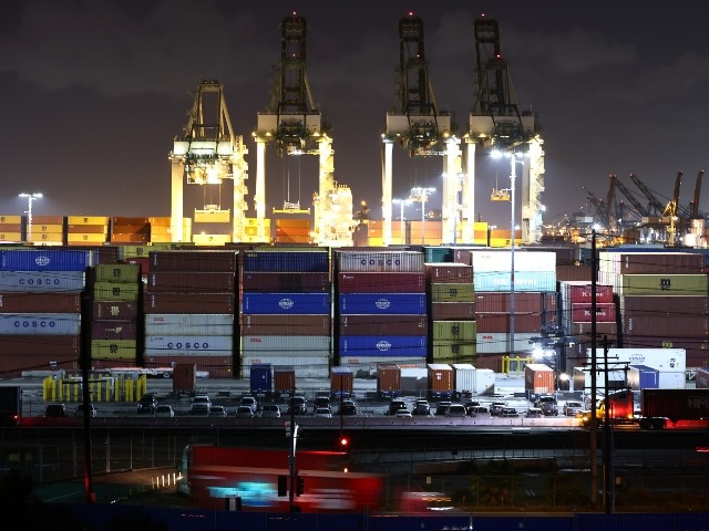 Trucks operate at the Port of Los Angeles during night operations on October 25, 2021 in San Pedro, California. The Port of Los Angeles is joining the Port of Long Beach in 24/7 operations amid efforts to ease supply chain issues. (Mario Tama/Getty Images)