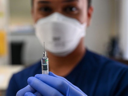 A nurse prepares a dose of the Sinopharm Covid-19 coronavirus vaccine at the Mount Elizabeth hospital vaccine centre in Singapore on September 7, 2021. (Photo by Roslan Rahman / AFP) (Photo by ROSLAN RAHMAN/AFP via Getty Images)