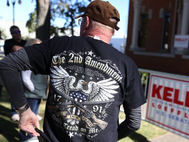 MONROE, GEORGIA - OCTOBER 30: A supporter U.S. Sen. Kelly Loeffler (R-GA) wears a second amendment shirt during a campaign event at the Walton County Historic Courthouse on October 30, 2020 in Monroe, Georgia. With four days until election day, Sen. Kelly Loeffler is running for re-election after being appointed …