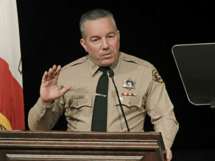 In this Dec. 3, 2018 file photo, Los Angeles County Sheriff Alex Villanueva speaks during a ceremony in Monterey Park, Calif. Villanueva says inmates at a jail tried to infect themselves with the coronavirus by sharing a cup of water and a mask, and showed surveillance videos from two units …