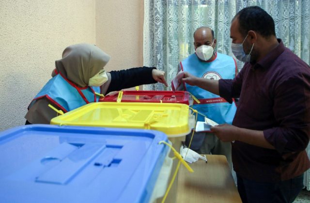Libyans cast their ballots during the second round of municipal elections, at a voting cen