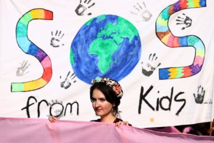 Scores of schoolchildren and their parents handed over a 100,000-signature petition urging