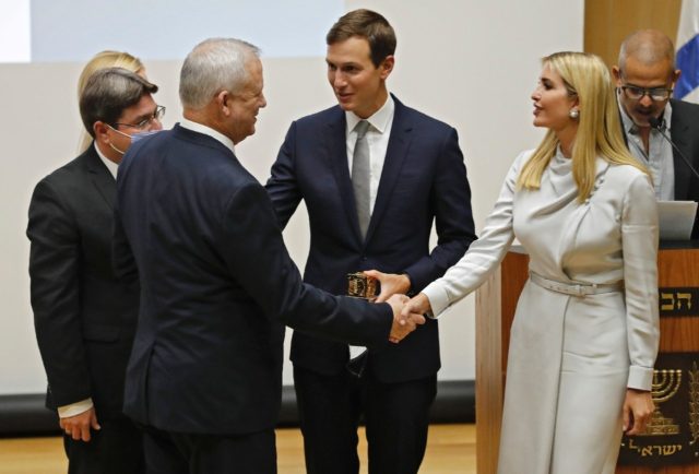 Israeli Defence Minister Benny Gantz (L) shakes hands with Ivanka Trump alongside her husband Jared Kushner (C) during the inaugural event of the Abraham Accords Caucus, at Israel's parliament, the Knesset