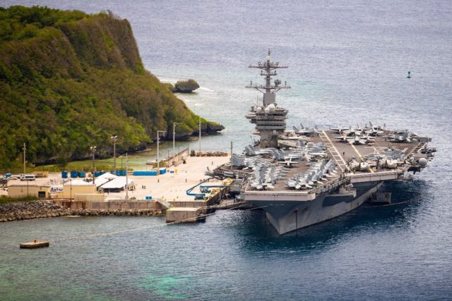 The aircraft carrier USS Theodore Roosevelt moored at Naval Base Guam last May after being forced to port due to a Covid-19 outbreak that infected around one-quarter of the vessel's 4,800 crew.