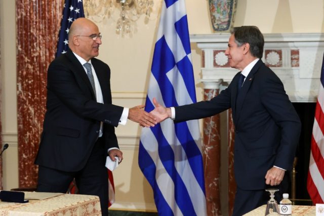 US Secretary of State Antony Blinken and Greek Foreign Minister Nikos Dendias shake hands