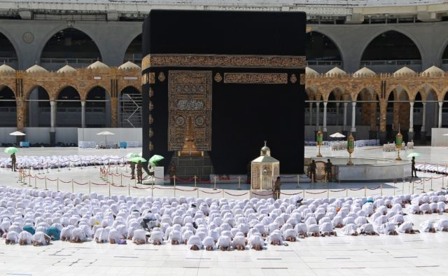 Normal service resumes: worshippers pray shoulder to shoulder at the Grand Mosque in the h