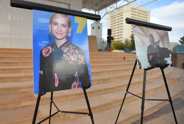 Photos of cinematographer Halyna Hutchins are displayed ahead a vigil held in her honor on
