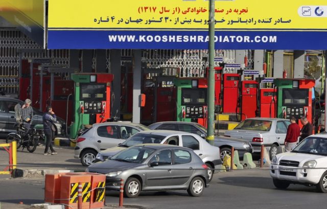 Motorists queue to fill up at a petrol station in Iran's capital Tehran on October 26, 2021 after distribution was hit by a cyberattack
