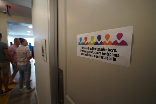A sign on a bathroom door at a senior living facility in Houston, Texas in June 2021 reads