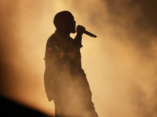 Kanye West performs on the main Pyramid stage during the Glastonbury music festival on Sat
