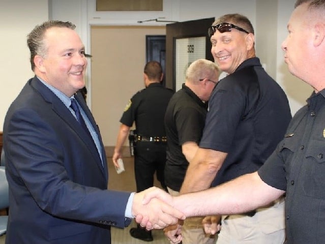 Rep. Alex Mooney (R-WV) shakes hands with law enforcement officers. (Alex Mooney/Facebook)