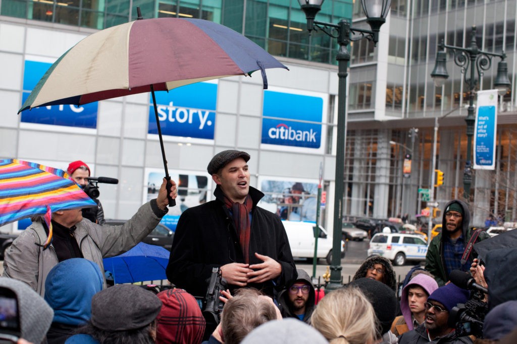 Author and journalist Matt Taibbi speaks to a crowd of Occupy Wall Street protestors after a march on the offices of pharmaceutical giant Pfizer, Wednesday, Feb. 29, 2012, in New York. There was a heavy police presence around the 42nd Street area as the demonstration began Wednesday morning outside. (AP Photo/John Minchillo)