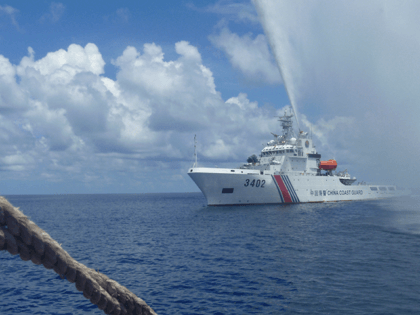 In this Sept. 23, 2015, file photo, Chinese Coast Guard members approach Filipino fishermen as they confront each other off Scarborough Shoal in the South China Sea, also called the West Philippine Sea. Philippine President Rodrigo Duterte, who has considerably reduced tensions with China over contested South China Sea waters, …