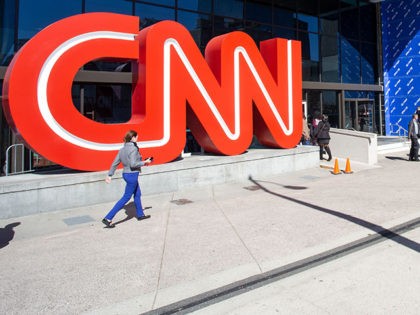 People walk outside CNN Center, Wednesday, Oct. 24, 2018, in Atlanta. CNN is now screening