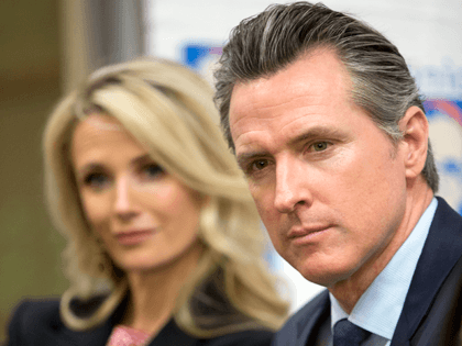 California Gov. Gavin Newsom, right, with his wife Jennifer Siebel Newsom listen during a roundtable discussion with Central American community leaders at the Clinica Monsenor Oscar Romero in Los Angeles Thursday, March 28, 2019. Newsom said Thursday he will travel to El Salvador in April to discuss the poverty and …