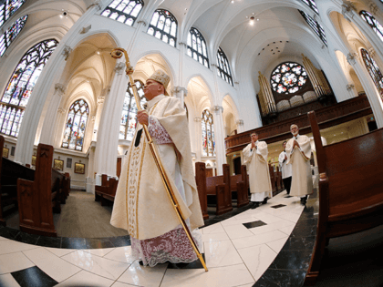 In this Sunday, April 12, 2020 file photo, Denver Archbishop Samuel J. Aquila enters the Cathedral Basilica of the Immaculate Conception to deliver Easter Mass during a broadcast of services because of the new coronavirus in Denver. “There is danger to one’s soul if he or she receives the body …