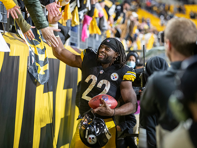 Pittsburgh Steelers running back Najee Harris (22) high fives fans after an NFL football g