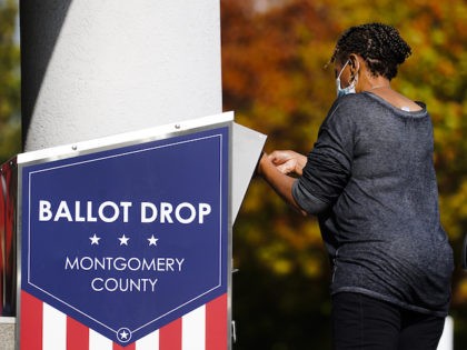 A person drops off a mail-in ballot at an election ballot return box in Willow Grove, Pennsylvania, October 25, 2021. (AP Photo/Matt Rourke)