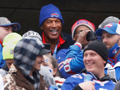Buffalo Bills Hall of Fame running back O.J. Simpson poses with fans prior to an NFL football game against the Miami Dolphins, Sunday, Oct. 31, 2021, in Orchard Park, N.Y. (AP Photo/Jeffrey T. Barnes)