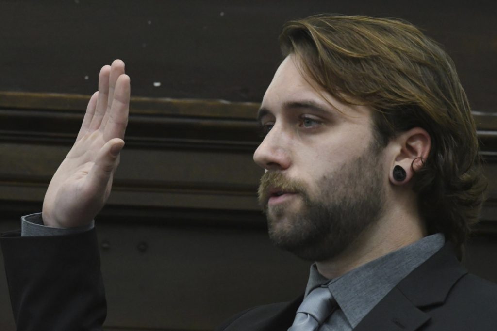 Gaige Grosskreutz is sworn in before he testifies about being shot in the right bicep during the Kyle Rittenhouse trial at the Kenosha County Courthouse in Kenosha, Wis., on Monday, Nov. 8, 2021. (Mark Hertzberg/Pool Photo via AP)