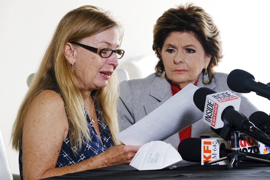 Attorney Gloria Allred looks on as Script Supervisor, Mamie Mitchell emotionally reads a statement during a news conference with on Wednesday, Nov. 17, 2021 in Los Angeles. Allred announced a lawsuit on behalf of Mitchell, who was on set with a prop gun being used by Alec Baldwin went off, killing cinematographer Halyna Hutchins and wounding the film's director. (AP Photo/Richard Vogel)