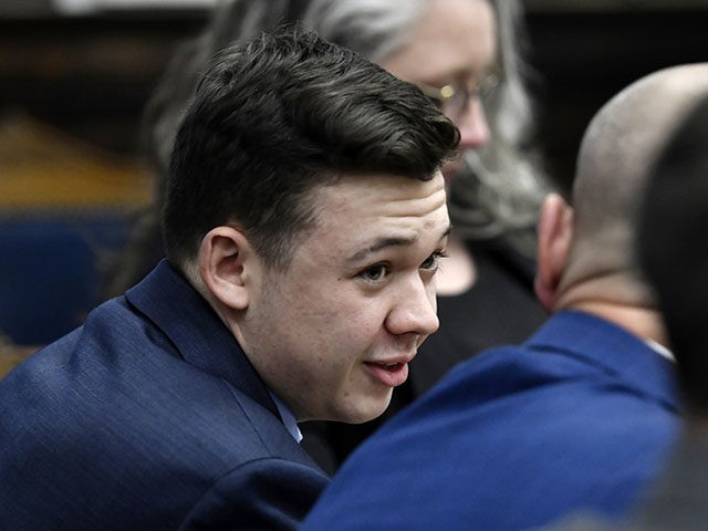 Defendant Kyle Rittenhouse speaks with his attorneys before the jury is relieved for the day during his trial at the Kenosha County Courthouse in Kenosha, Wis., on Thursday, Nov. 18, 2021. (Sean Krajacic/The Kenosha News via AP, Pool)