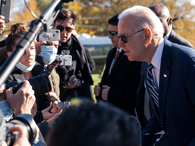 President Joe Biden leans to hear a reporter's question as he returns to the White House, Friday, Nov. 19, 2021, in Washington, from Walter Reed National Military Medical Center. (AP Photo/Alex Brandon)