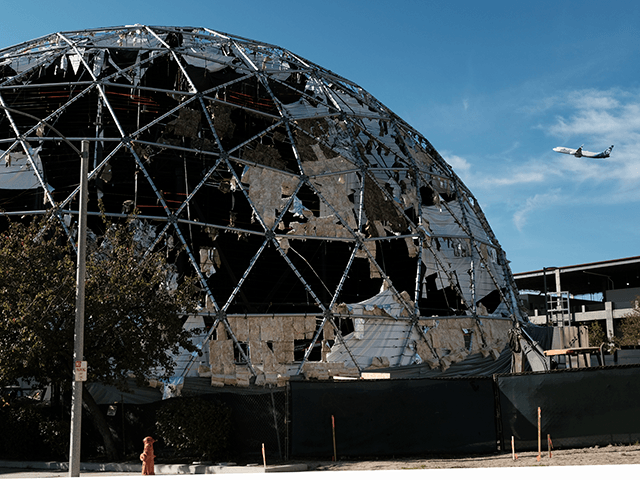 A large dome used as a studio production facility near the Burbank Airport is shredded from strong winds that passed through the area on Friday, Nov. 26, 2021 in Burbank, Calif. Santa Ana winds were declining in strength Friday but thousands of Southern California utility customers remained without electricity due …