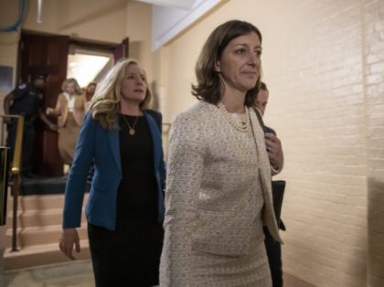 Rep. Elaine Luria, D-Va., right, followed by Rep. Abigail Spanberger, D-Va., left, leave a House Democratic Caucus meeting with Speaker of the House Nancy Pelosi, D-Calif., where she was persuaded to launch a formal impeachment inquiry against President Donald Trump, at the Capitol in Washington, Tuesday, Sept. 24, 2019. Rep. …
